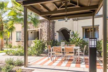 Lush landscaping with outdoor patio space throughout